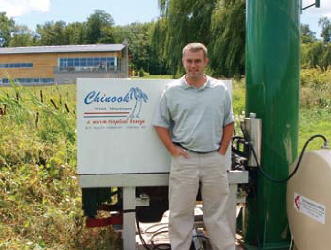 Curtis Fielding of Fielding Estate Winery beside a Chinook wind machine